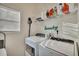 Laundry room with washer, dryer, and overhead shelving at 4334 Austin Farm Trl, Acworth, GA 30101