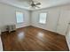 Bright bedroom with hardwood floors and ceiling fan at 5791 Warren Farm Sw Rd, Powder Springs, GA 30127