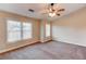 Bright bedroom with vaulted ceiling, ceiling fan and neutral carpeting at 6033 Bayrose Cir # 33A, East Point, GA 30344