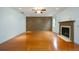 Living room with hardwood floors and fireplace at 12548 Kensington Blvd, Alpharetta, GA 30005