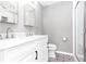 Elegant bathroom with double sinks, marble counters, and a walk-in shower at 1494 Willow Bnd, Woodstock, GA 30188