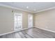 Bright dining room with hardwood floors and neutral walls at 1494 Willow Bnd, Woodstock, GA 30188