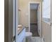 Bathroom with granite countertop vanity, toilet, and marble flooring at 4083 Thetford Ct, Decatur, GA 30035