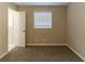 Bedroom with neutral walls, carpet flooring, and a window at 4083 Thetford Ct, Decatur, GA 30035
