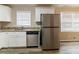 Kitchen with white cabinets, stainless steel appliances, granite counters at 4083 Thetford Ct, Decatur, GA 30035