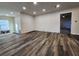 Unfinished basement space with new vinyl flooring and recessed lighting at 188 Oak Dr, Atlanta, GA 30354