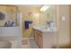 Neutral bathroom with a shower-tub combo with glass doors, single sink vanity and linen closet at 2210 Burdett Ridge, Atlanta, GA 30349