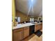 Kitchen island with white countertops and black appliances at 2210 Burdett Ridge, Atlanta, GA 30349