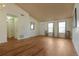 Open living room with wood floors, neutral walls, and natural light from the double-paned windows at 2210 Burdett Ridge, Atlanta, GA 30349