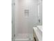 Spa-like shower with textured white wall tiles and glass enclosure at 2870 Daws Se Ave, Atlanta, GA 30317