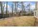 Spacious backyard with a wooden fence and mature trees at 679 Crosswinds Cir, Marietta, GA 30008