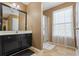 Bathroom with vanity, shower, and window at 679 Crosswinds Cir, Marietta, GA 30008