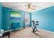 Bedroom with exercise bike and teal accent chair at 679 Crosswinds Cir, Marietta, GA 30008