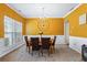 Bright dining room features hardwood floors and yellow walls at 679 Crosswinds Cir, Marietta, GA 30008