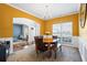 Dining room with hardwood floors, yellow walls and a chandelier at 679 Crosswinds Cir, Marietta, GA 30008