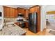 Kitchen with granite countertops, stainless steel appliances, and wood cabinets at 679 Crosswinds Cir, Marietta, GA 30008