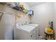 Laundry room with washer, dryer, and shelving at 679 Crosswinds Cir, Marietta, GA 30008