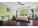 Main bedroom features hardwood floors, green walls and a ceiling fan at 679 Crosswinds Cir, Marietta, GA 30008