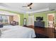 Large main bedroom with green walls, hardwood floors and ensuite bath at 679 Crosswinds Cir, Marietta, GA 30008