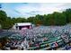 Large outdoor amphitheater filled with audience during performance at 94 Sheridan Dr, Atlanta, GA 30305