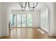 Bright dining room features hardwood floors and an arched doorway at 94 Sheridan Dr, Atlanta, GA 30305