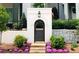 Charming entry gate with stone accents and landscaping at 94 Sheridan Dr, Atlanta, GA 30305