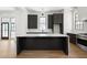 Sleek kitchen with marble island and dark cabinetry at 94 Sheridan Dr, Atlanta, GA 30305