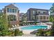 Community pool with lounge chairs and umbrellas at 94 Sheridan Dr, Atlanta, GA 30305