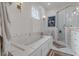 Bright bathroom with a soaking tub and separate glass shower at 1736 Thompson Ave, Atlanta, GA 30344