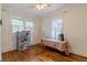 Bedroom featuring hardwood floors, natural light, and a ceiling fan at 1736 Thompson Ave, Atlanta, GA 30344