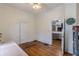 Bedroom with hardwood floors and access to an adjacent room at 1736 Thompson Ave, Atlanta, GA 30344