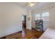 Bedroom with hardwood floors and access to an adjacent room at 1736 Thompson Ave, Atlanta, GA 30344