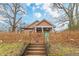 Charming craftsman home with a picket fence and manicured front yard at 1736 Thompson Ave, Atlanta, GA 30344