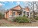 Charming craftsman home with a covered front porch and mature trees at 1736 Thompson Ave, Atlanta, GA 30344