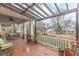 Inviting front porch with seating, a pergola and decorative plants at 1736 Thompson Ave, Atlanta, GA 30344