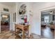 View into kitchen with checkerboard floors, wooden island, and open access to the living room at 1736 Thompson Ave, Atlanta, GA 30344