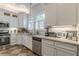 Modern kitchen featuring white cabinets, granite countertops, and stainless steel appliances at 1736 Thompson Ave, Atlanta, GA 30344