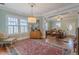 Inviting living room with hardwood floors, natural light, and a decorative rug and furnishings at 1736 Thompson Ave, Atlanta, GA 30344