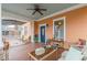 Welcoming front porch with an inviting seating arrangement and stained wood flooring at 1736 Thompson Ave, Atlanta, GA 30344