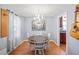 Charming dining room with chandelier and hardwood floors at 2778 Majestic Cir, Dacula, GA 30019