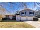 Two-story house with blue siding, white brick, and a two-car garage at 2778 Majestic Cir, Dacula, GA 30019