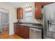 Well-equipped kitchen featuring dark wood cabinets and granite countertops at 2778 Majestic Cir, Dacula, GA 30019