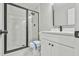 Updated bathroom with white vanity and frameless glass shower at 2836 Crescendo Dr, Atlanta, GA 30318