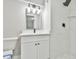 Modern bathroom with white vanity, marble tile shower, and updated fixtures at 2836 Crescendo Dr, Atlanta, GA 30318