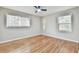 Hardwood floor bedroom with two windows and ceiling fan at 2836 Crescendo Dr, Atlanta, GA 30318