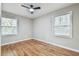 Spacious bedroom with hardwood floors and two windows at 2836 Crescendo Dr, Atlanta, GA 30318