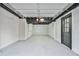 Finished garage with painted floor and extra storage at 2836 Crescendo Dr, Atlanta, GA 30318