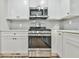 Modern kitchen features stainless steel appliances and white shaker cabinets at 2836 Crescendo Dr, Atlanta, GA 30318