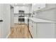 Modern kitchen with white shaker cabinets, quartz countertops, and stainless steel appliances at 2836 Crescendo Dr, Atlanta, GA 30318