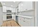 Modern kitchen with white cabinets, quartz countertops, and stainless steel appliances at 2836 Crescendo Dr, Atlanta, GA 30318